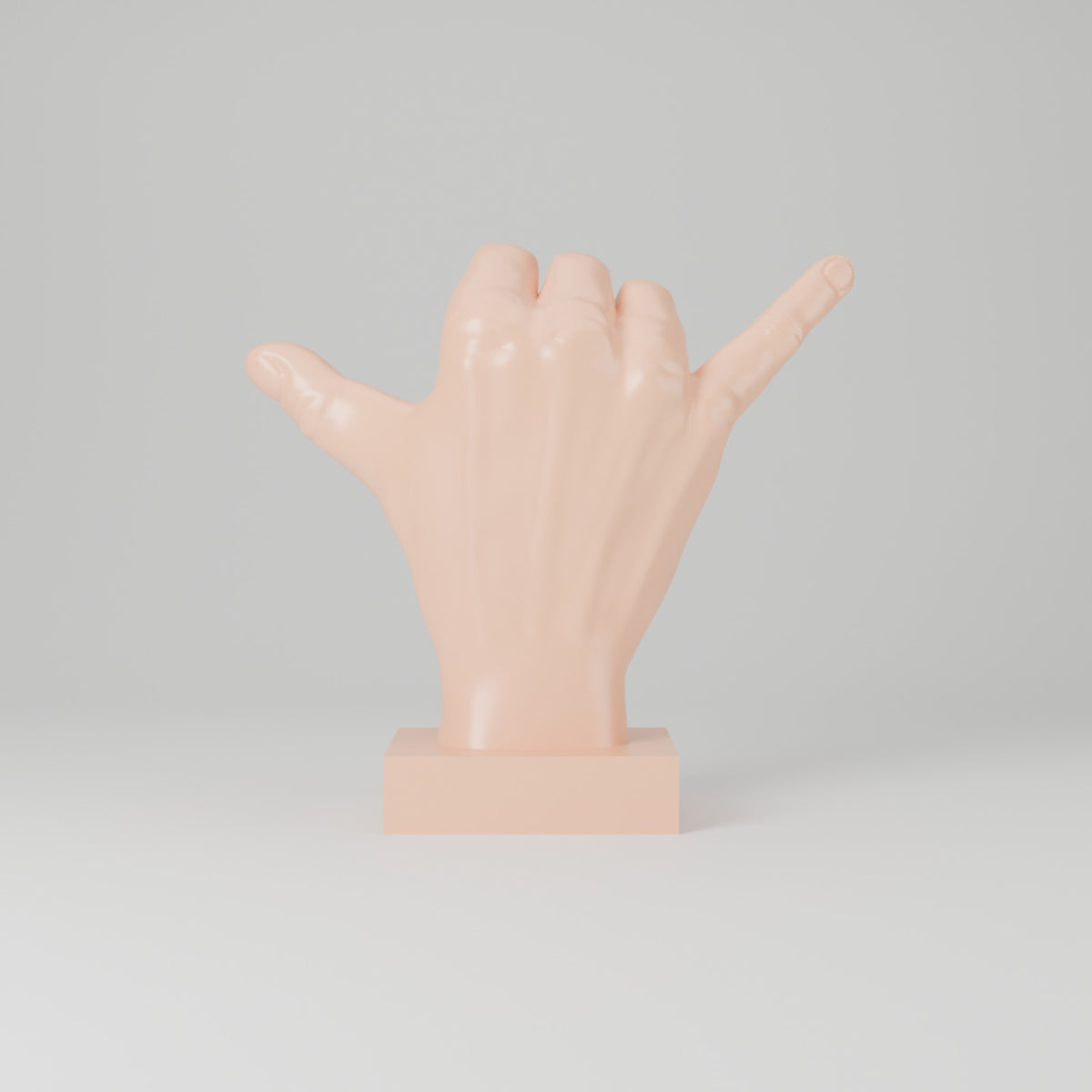 Shaka hand desk sculpture peach front view